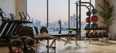 Modern hotel fitness center in Qatar featuring premium cardio machines, strength equipment, free weights, and functional training areas designed for luxury guest wellness experiences.