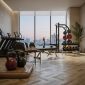Modern hotel fitness center in Qatar featuring premium cardio machines, strength equipment, free weights, and functional training areas designed for luxury guest wellness experiences.